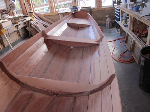 Wood Boat Building School Construction of wooden boat-local lumberyard ...