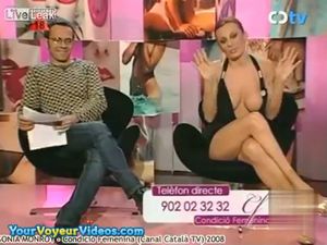 Tit flops out of ridiculous dress on live TV