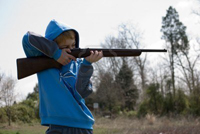 2726680-young-boy-firing-22-caliber-rifle-at-target.jpg