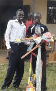 Olal Michael receiving his tools and equipment